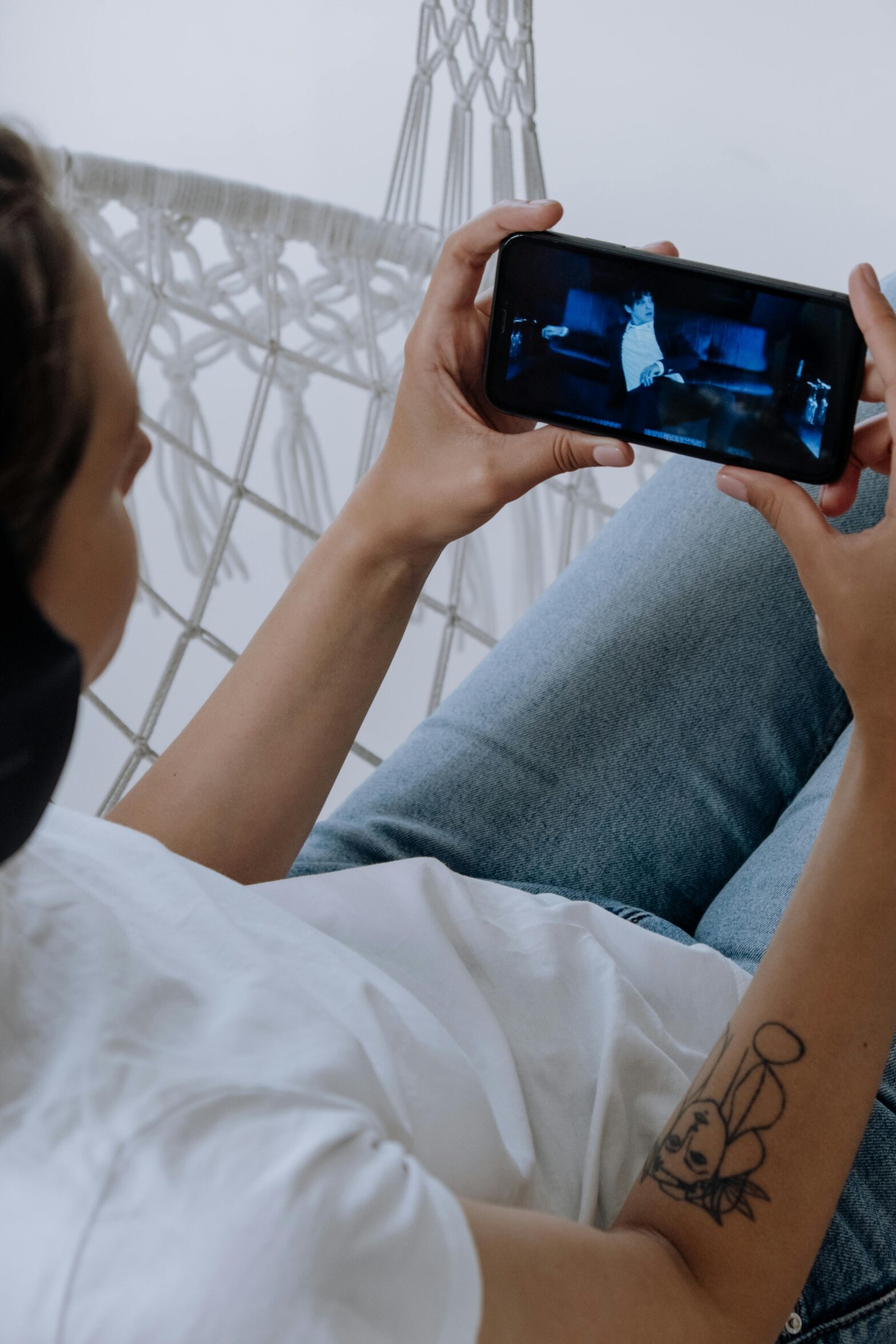 Person watching a music video on a phone