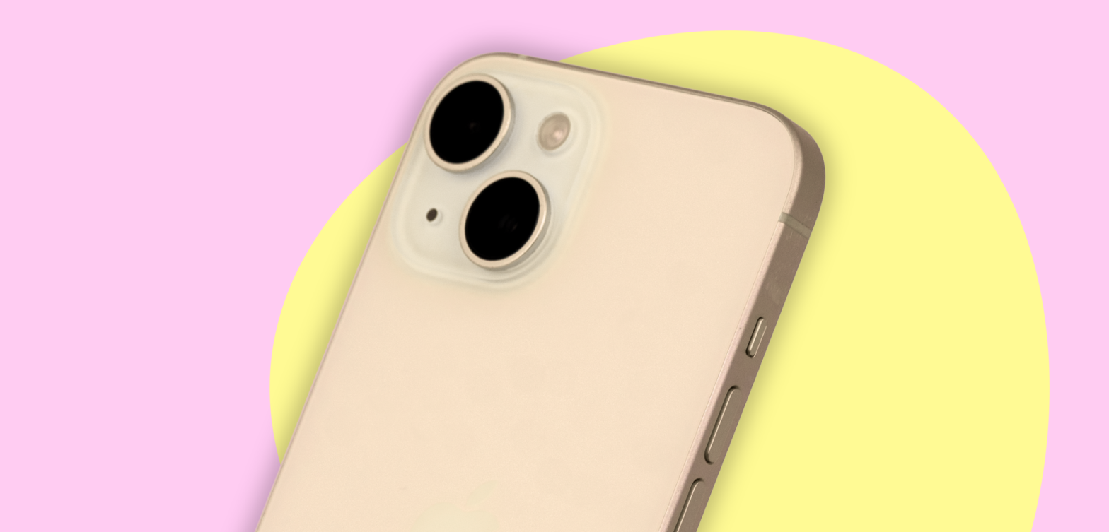 iPhone 15 yellow on a pink and yellow background