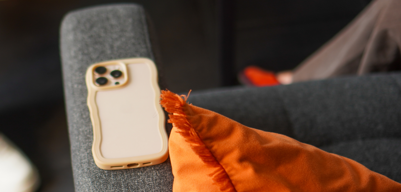 iPhone 16 Pro on an armchair