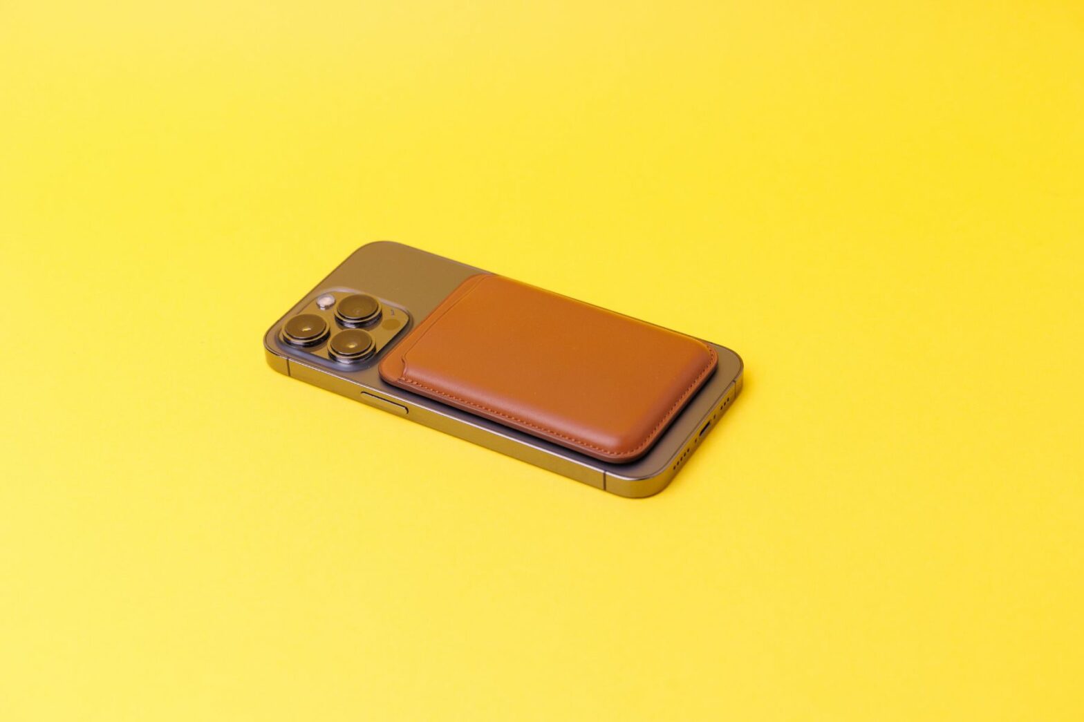 smartphone-with-a-leather-wallet-attached-to-it-is-2023-11-27-05-08-04-utc