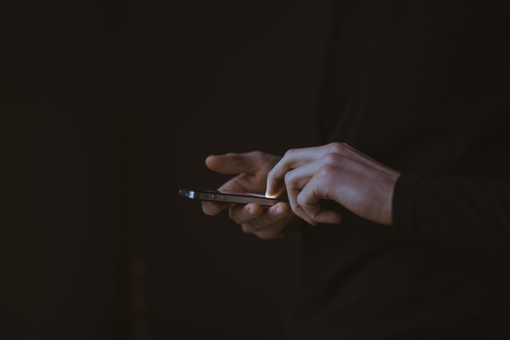 Hands holding an iphone